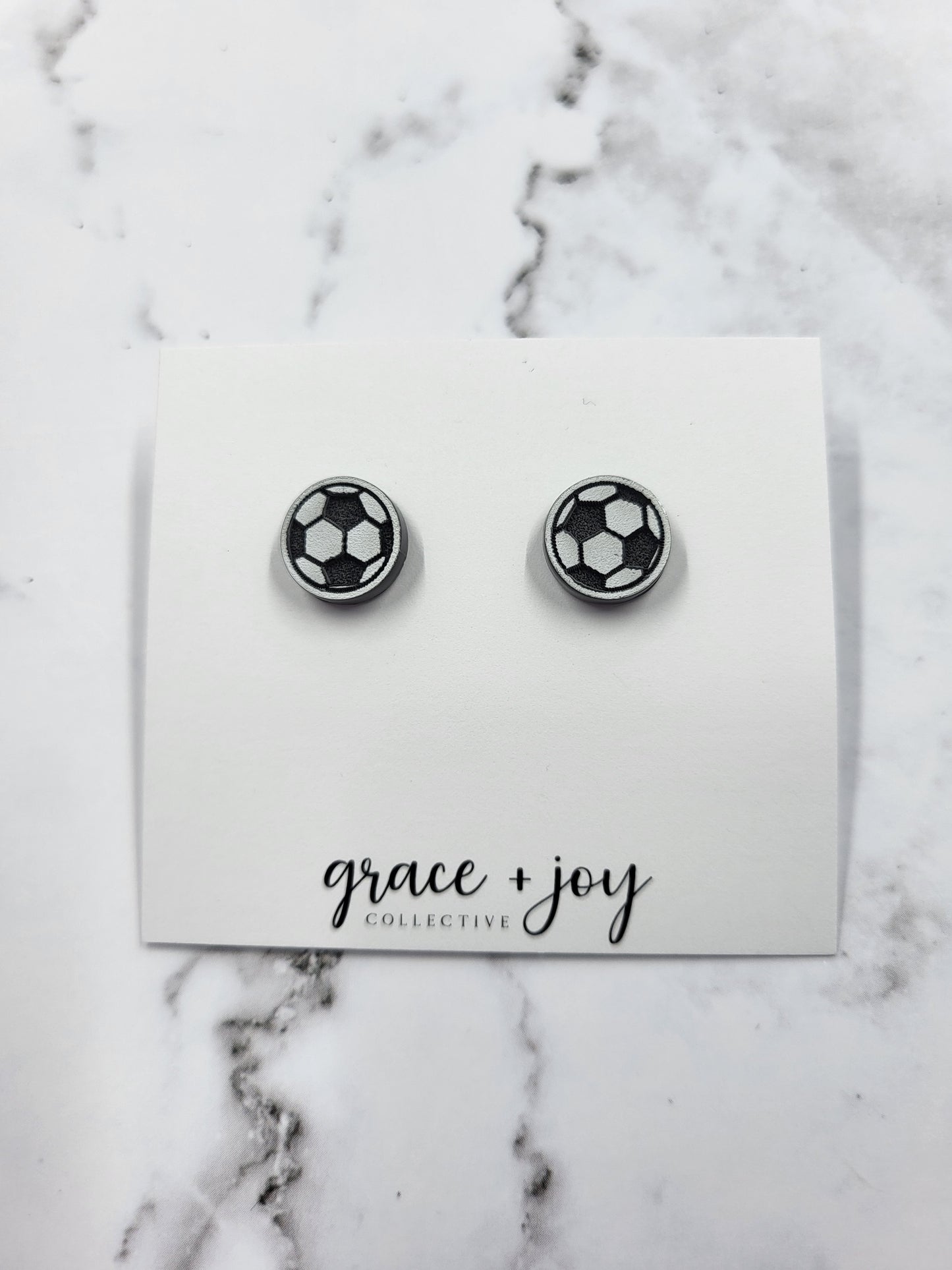 Handmade acrylic soccer ball stud earrings—lightweight, hypoallergenic, and perfect for players, fans, and soccer moms. A fun and unique gift!