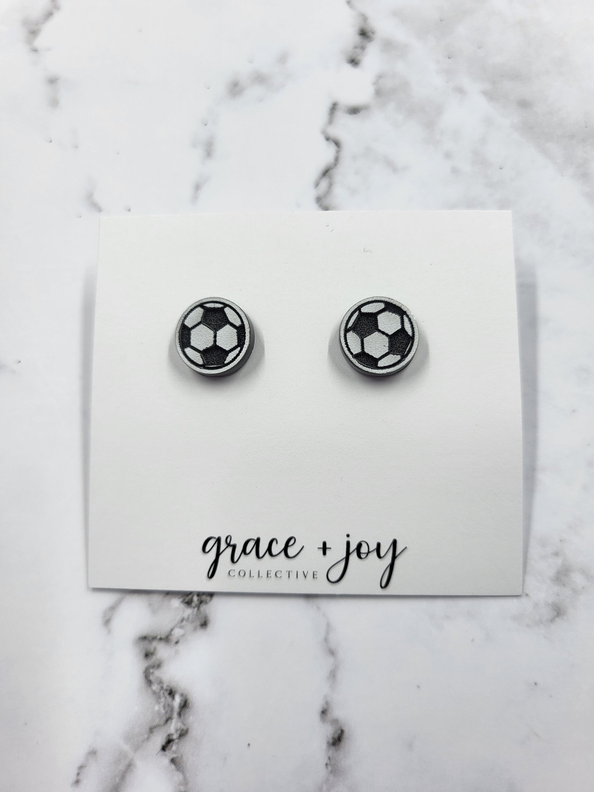 Handmade acrylic soccer ball stud earrings—lightweight, hypoallergenic, and perfect for players, fans, and soccer moms. A fun and unique gift!