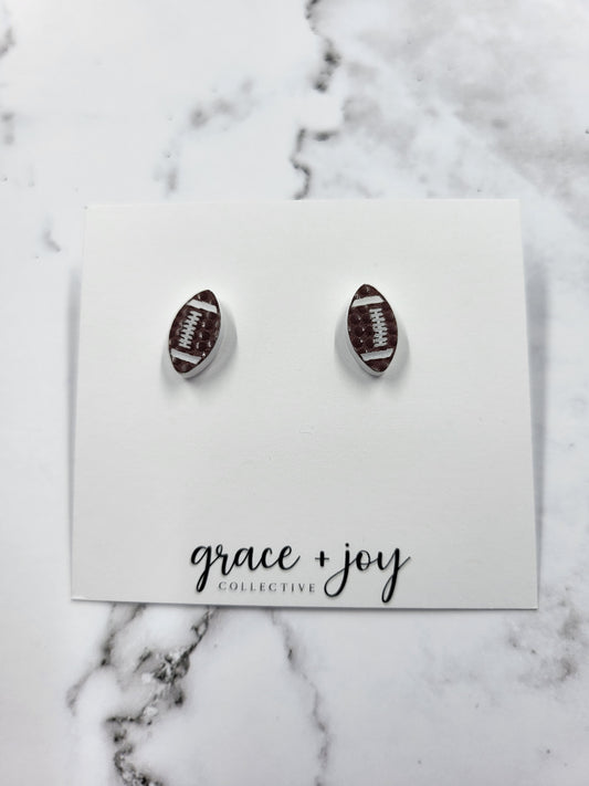 Handmade acrylic football stud earrings—lightweight, hypoallergenic, and perfect for game day. Unique gift for sports fans, moms, and team spirit wear.