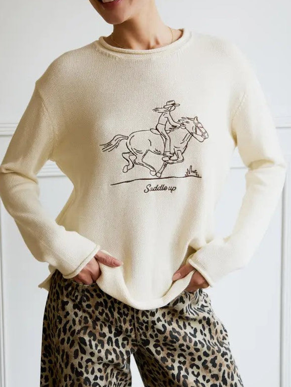 Saddle up in style! Western-inspired embroidered graphic sweater with cowboy & horse design. Cozy fall/winter knit by Sunday Edition.